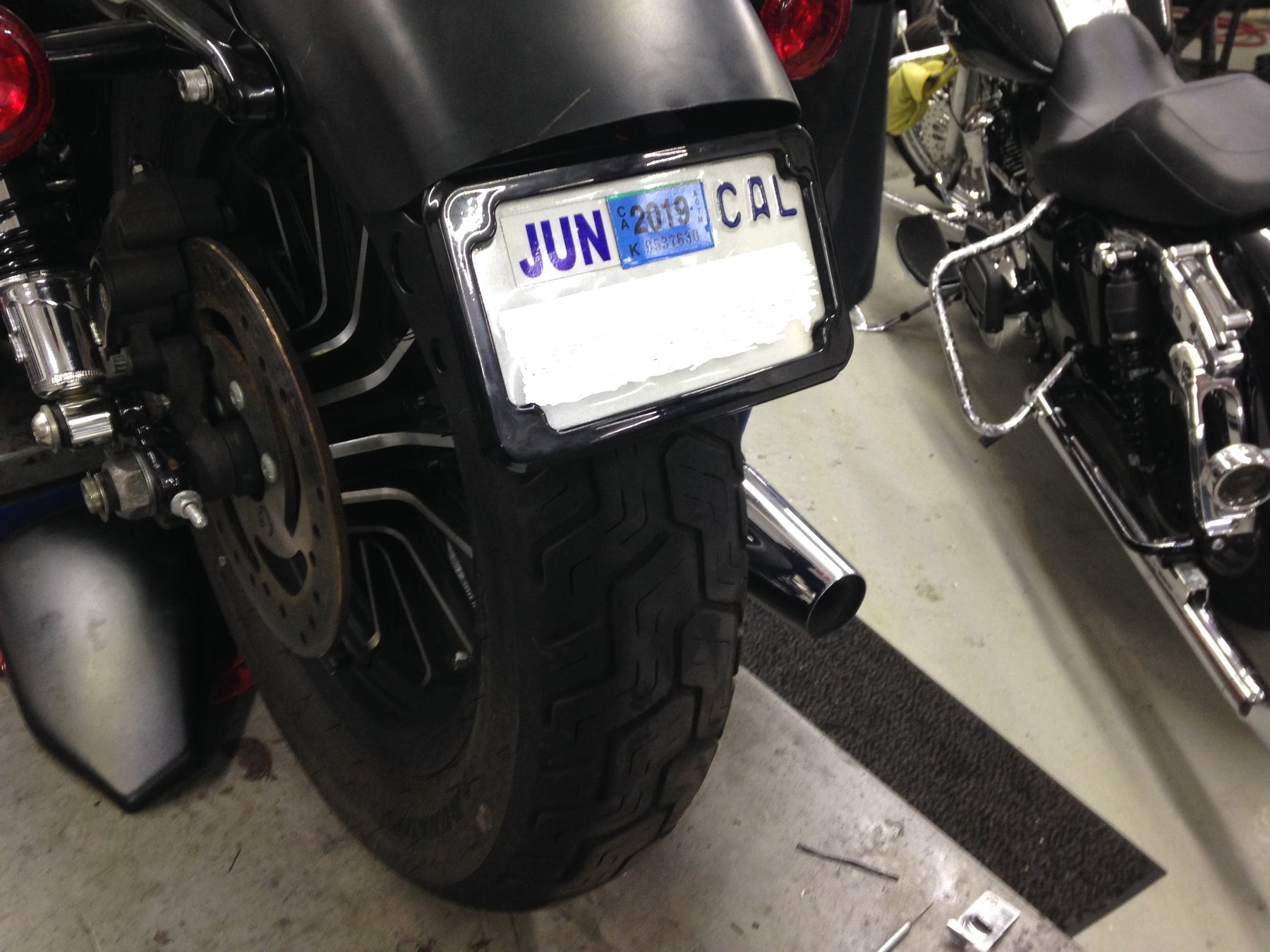 Curved License Plate Relocation - Sportster License Plate Cycle Visions